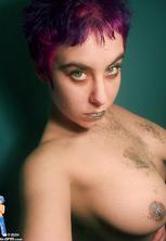 Stacked purple haired rave chick in glitter nude