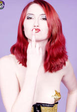 Redhead in gold fetish corset and high heels