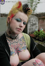 Hot tattooed punk babe by gravestone