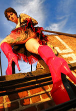 High heeled tattooed goth in high heels rooftop