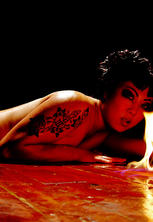 Slim eurasian girl in red fishnet satanic flames
