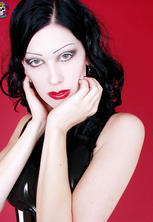 Stacked vamp in corset and tight rubber dress