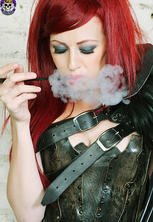 Smoking redhead goth babe in hot industrial corset