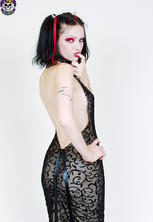 Porcelain-skinned gothic beauty in black gown