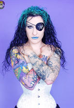 Gothic tattooed pirate girl smirks excited