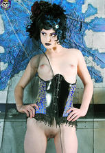 Fashionable corsetted gothic beauty undressed 