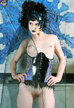 Fashionable corsetted gothic beauty undressed