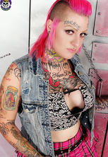 Tattooed punk rocker babe fucks beer bottle