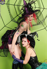 Two kinky witches giving halloween spankings