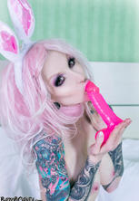 Tattooed gothic bunny babe with pink toy 