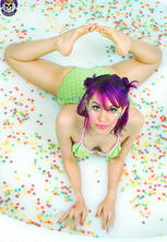 Pleasant bikini raver babe in pool of fruitloops