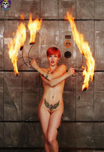 Tattooed redhead cutie fire dancer heats things up