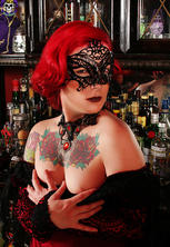 Redheaded goth babe ready for vampire ball