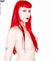 redhead goth chick strips off fetishwear spreads