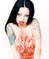tattooed vampire girl covers herself in blood