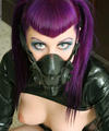 fetish beauty in a black latex chemical mask