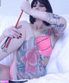 tattooed domme with whip, leash high heels dildo