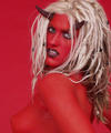 blonde painted red wearing horns of the devil