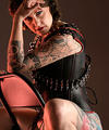 tattooed shaved guerilla girl corset high heels