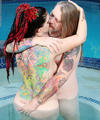Tattooed couple fucking in the hot tub