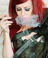 Smoking redhead Goth babe in hot industrial corset