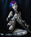 Gothic pin-up super-star in torn fishnets and purple hair